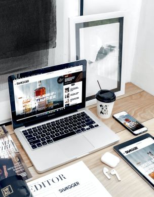 Macbook Pro Surrounded by Assorted Items