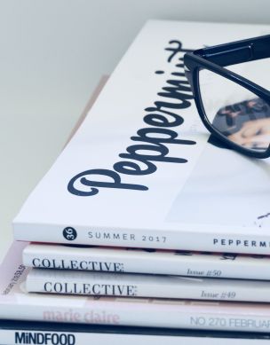 Photo of Eyeglasses On Top of Magazines