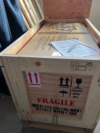 Here we see ISPM15 compliant heat treated wood shipping crate with corrugated boxes inside