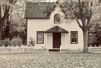 Small house with a picket fence in front