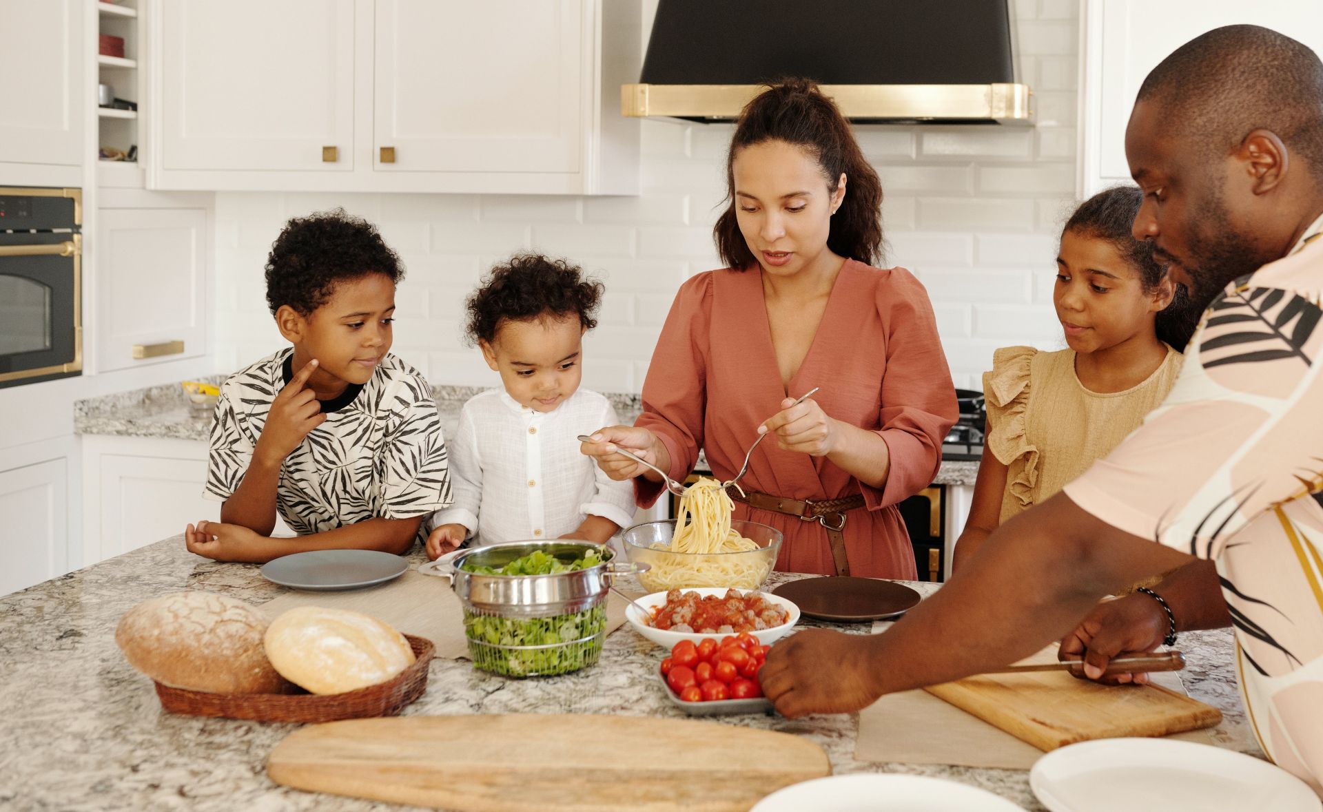 A Family Preparing Food in the Kitchen Togeher