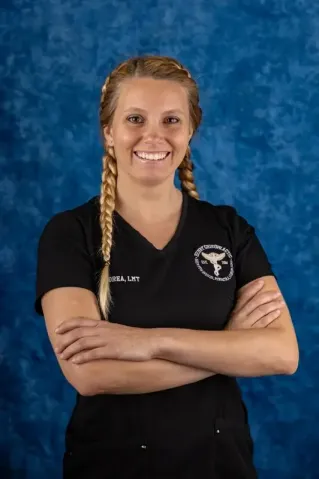 A licensed therapist giving a relaxing massage in a serene spa setting for wellness and relaxation.